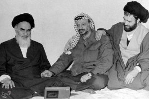 Khomeini and Yasser Arafat amicably holding hand